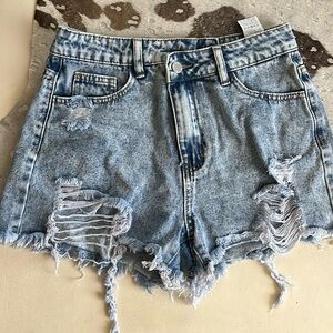 Distressed criss-cross shorts